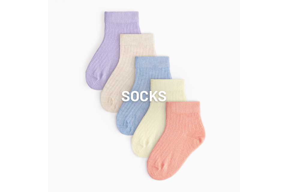 An image of 5 socks laying flat, in different pastel colours.