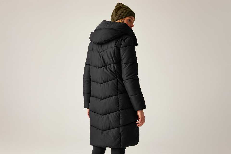 Two long winter coats displayed: a camel trench coat with a tie belt and a textured beige relaxed-fit coat worn over a white top and blue jeans.