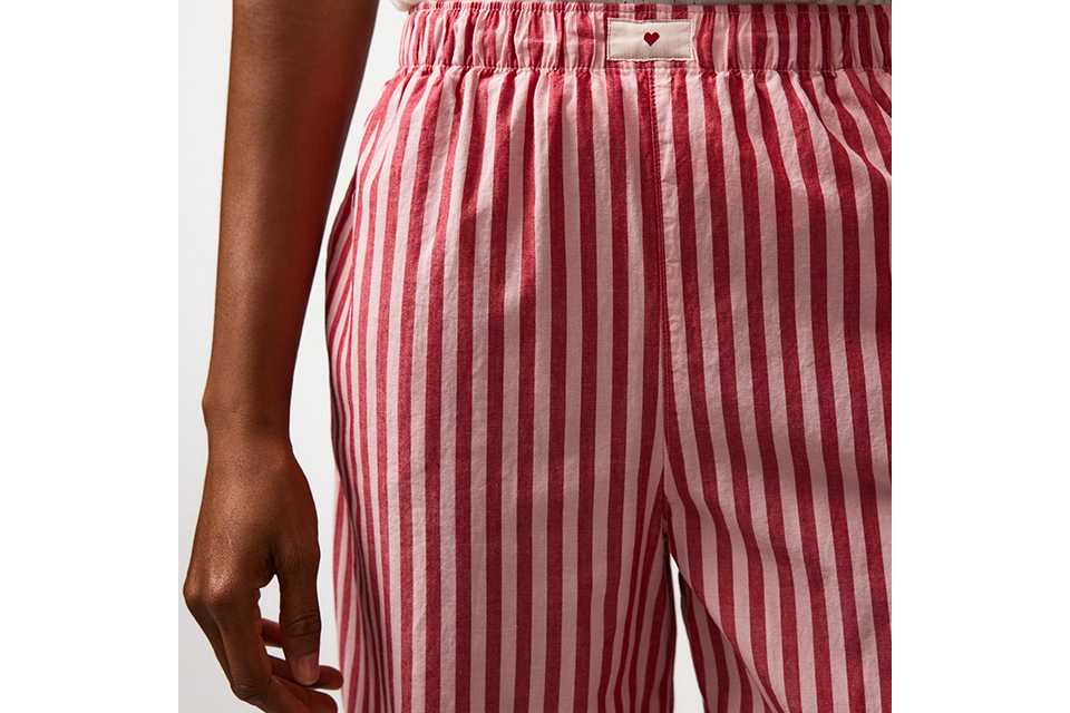 Red and white vertical striped pyjama bottoms.