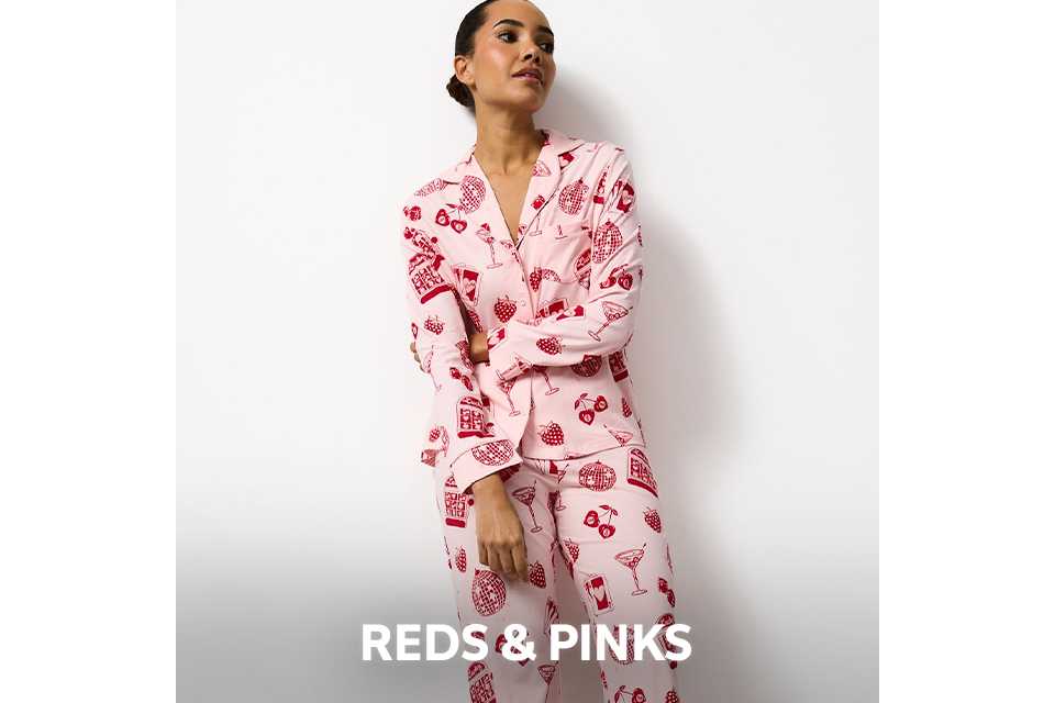 Pink pyjama set with red strawberry print.