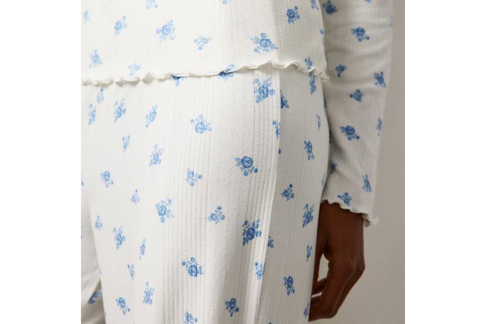 White nightwear with small blue floral print.