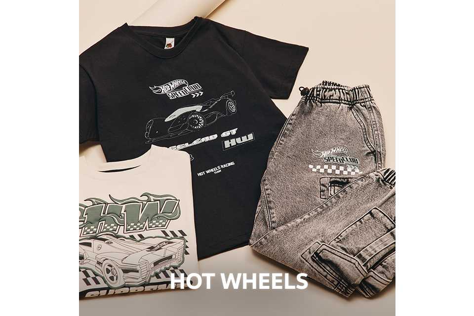 Flat lay of a black Hot Wheels T-shirt with car graphics, paired with grey joggers and additional printed tops.