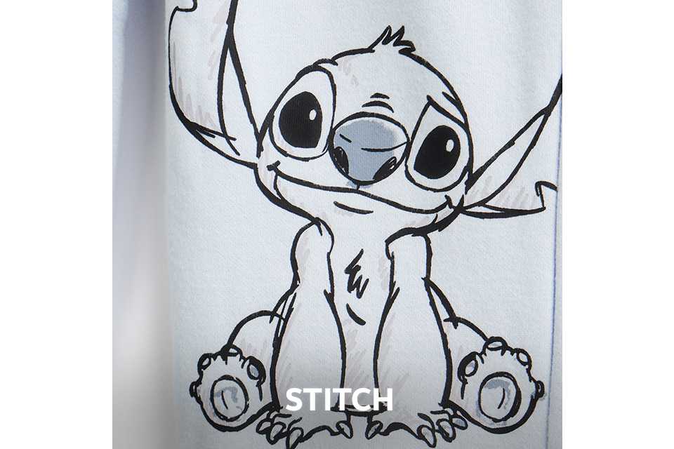 Child wearing a grey T‑shirt featuring a large Stitch graphic from Disney’s Lilo & Stitch.