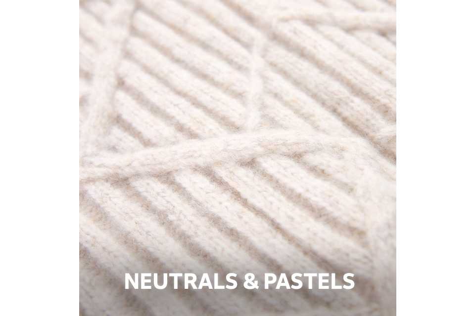 Close-up of cream textured yarn in a soft, neutral tone.