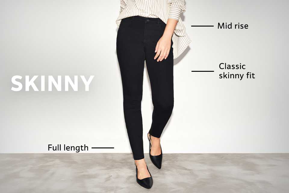 Mid-rise black skinny jeans with classic skinny fit and full-length design, styled with loafers and a striped shirt.