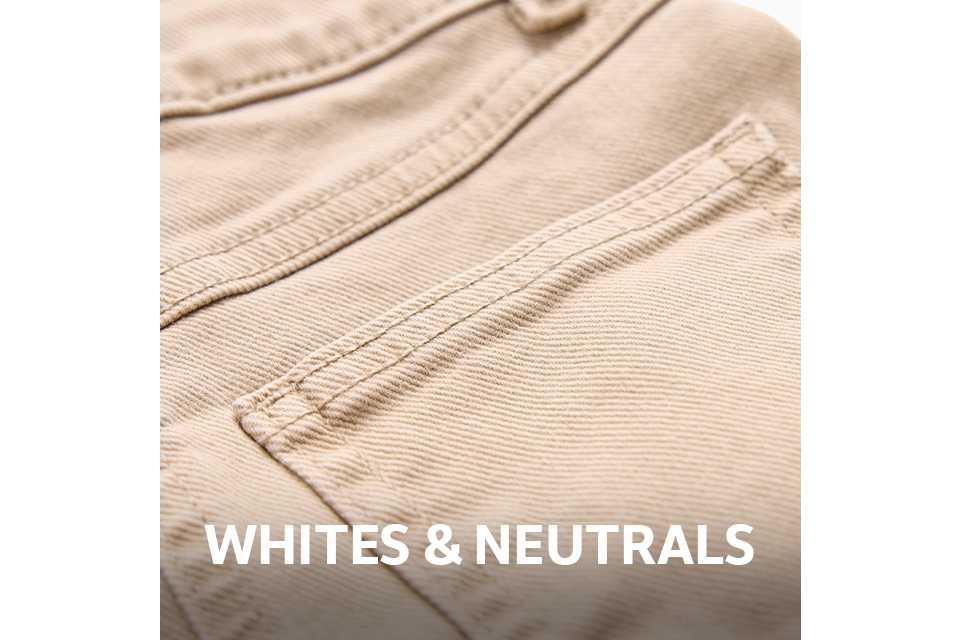 Close-up of the back pocket and waistband of beige denim jeans, featuring tonal stitching and a classic five-pocket design.