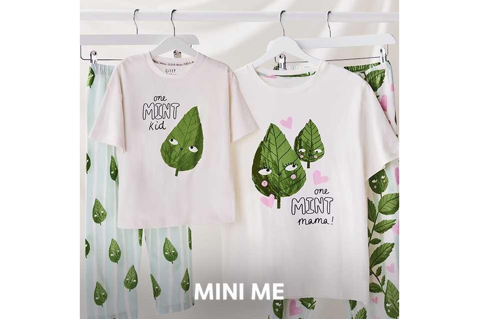 Matching striped pyjama sets with red piping detail worn by an adult and child.