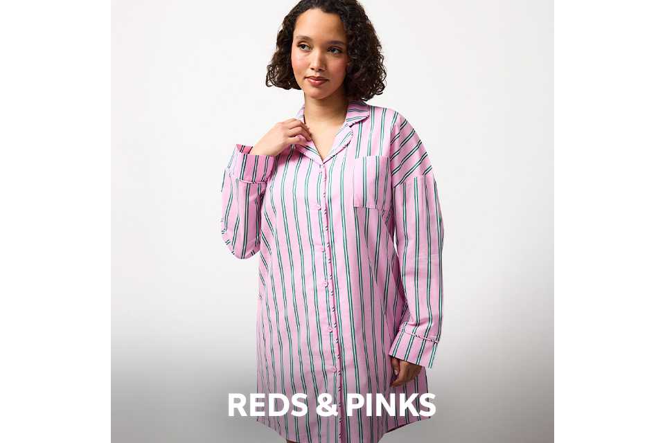 Pink pyjama set with red strawberry print.