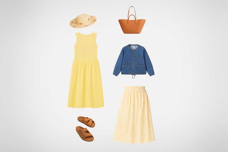 Seven-day holiday outfit flat lay featuring summer dresses, sandals, straw hat and lightweight jacket.