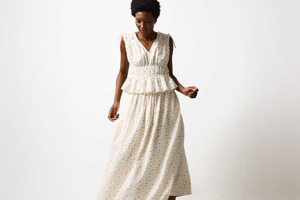 White textured summer dress styled for an elevated holiday outfit from day to evening.