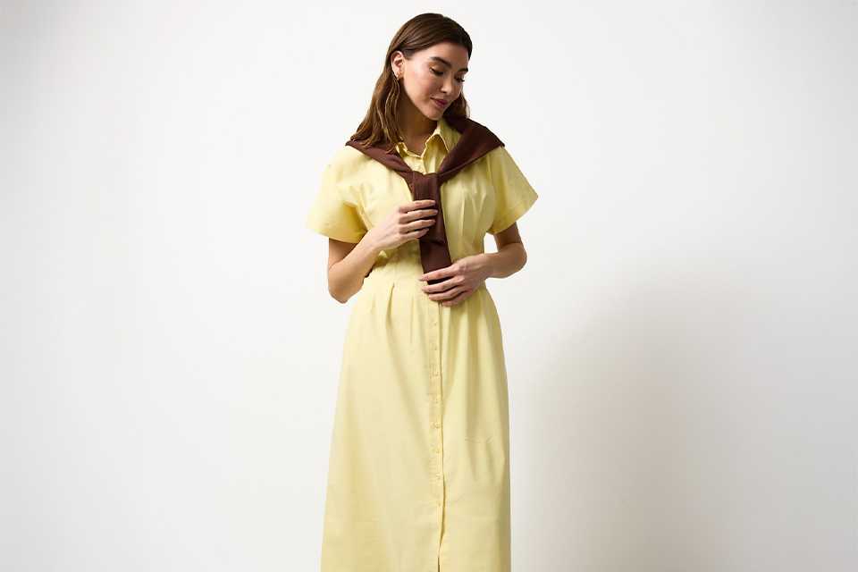 Yellow summer midi dress styled for warm-weather trends and effortless seasonal dressing.