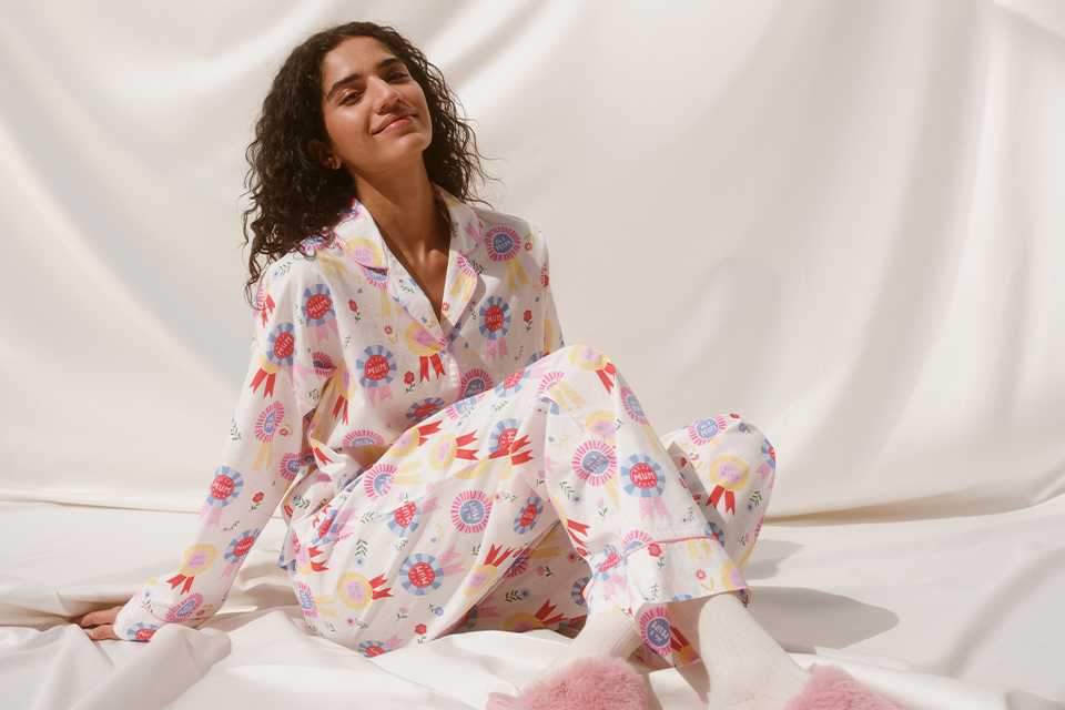 Floral print pyjama set styled with soft slippers, ideal for cosy loungewear and gift ideas.