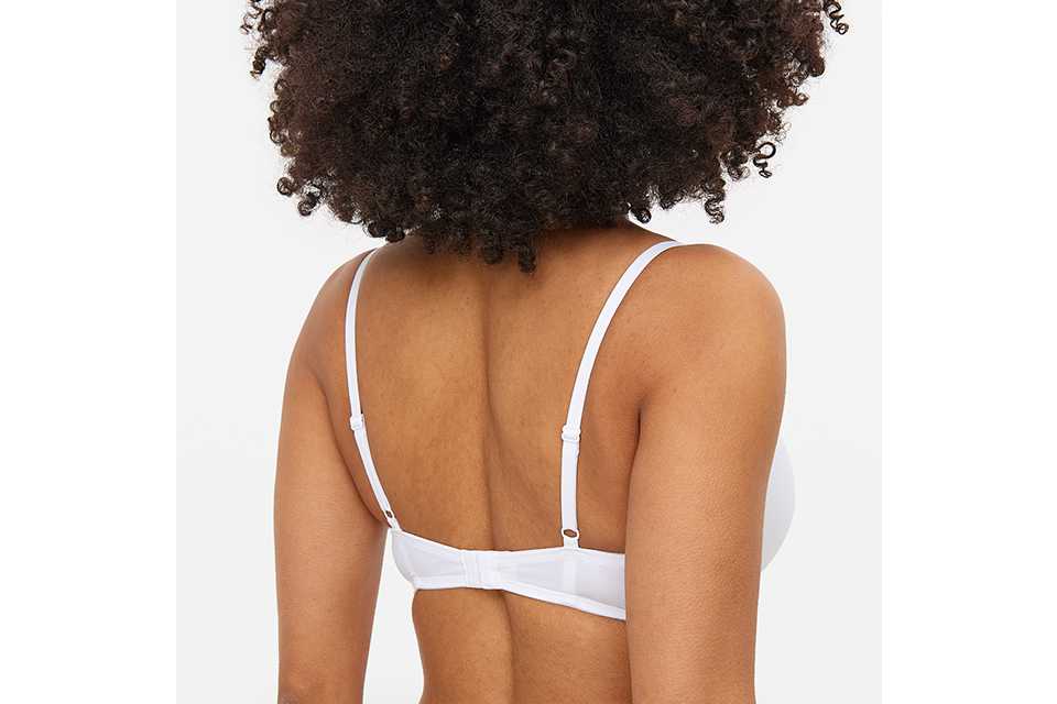 Why do my boobs come out of the bottom of my bra?