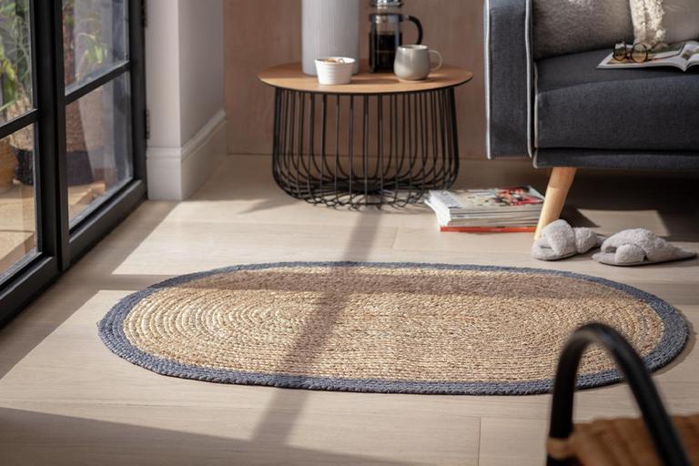 Oval natural flatweave rug in living room.
