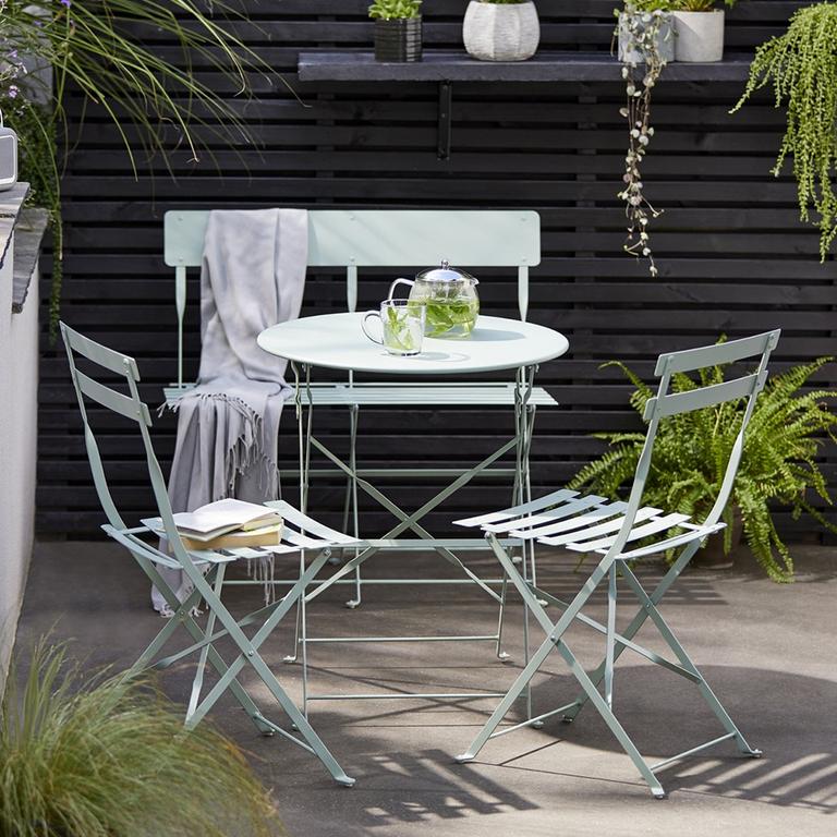 Image of a pale green patio bistro set.