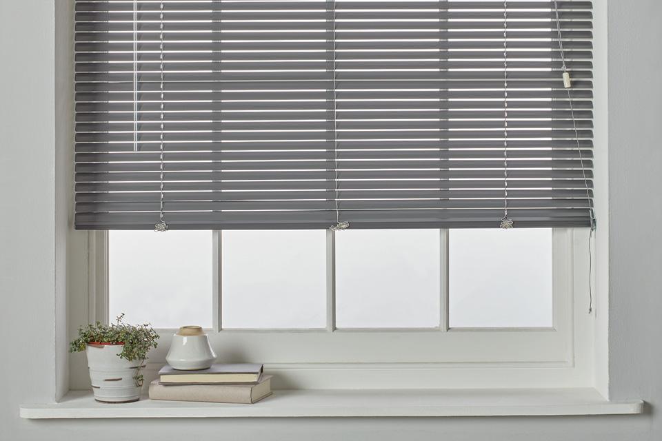 Grey venetian blinds.