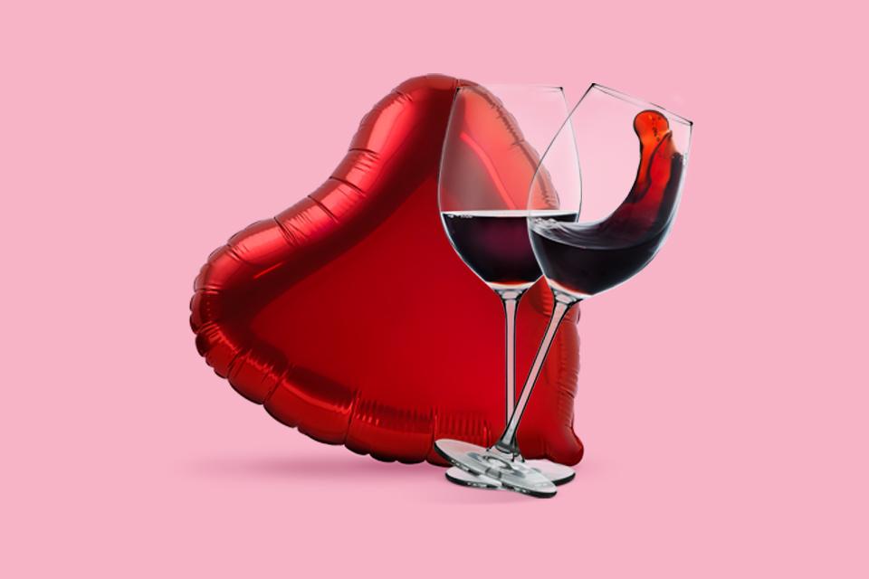 A pair of wine galsses on a love heart background.