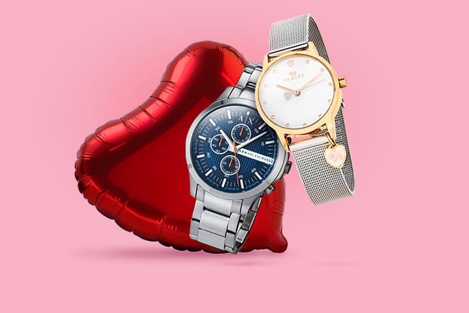 Two watches on a love heart background.