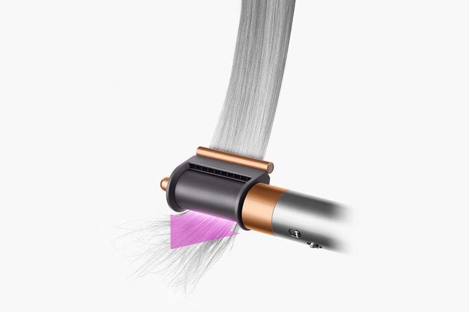 The Coanda smoothing dryer being used on dry hair to hide flyaways.