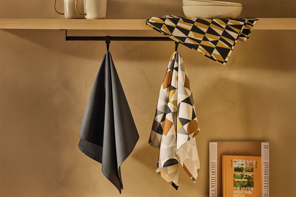Tea towels and oven gloves. Stylish protection for busy kitchens.