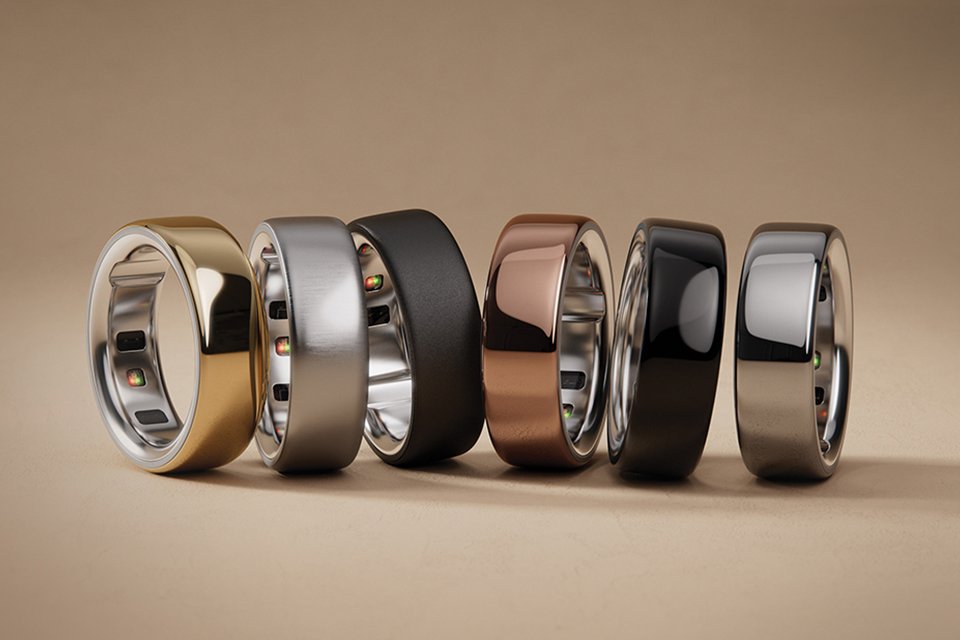 A collection of Oura rings on a gradient background.