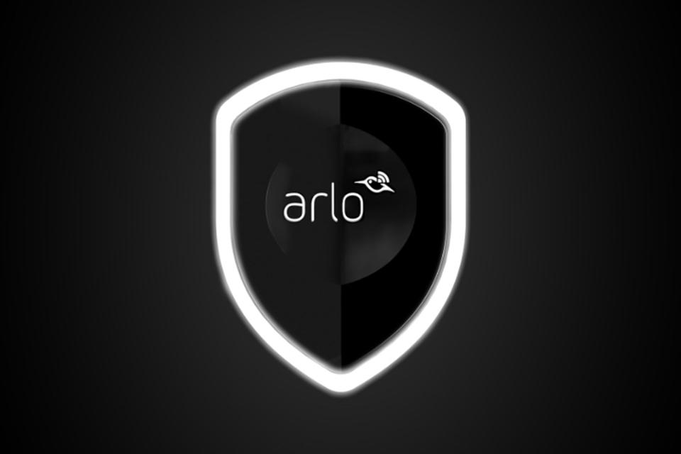 The Arlo logo, a glowing outline of a shield on a black background. Inside is text saying "Arlo" and a stylised hummingbird.