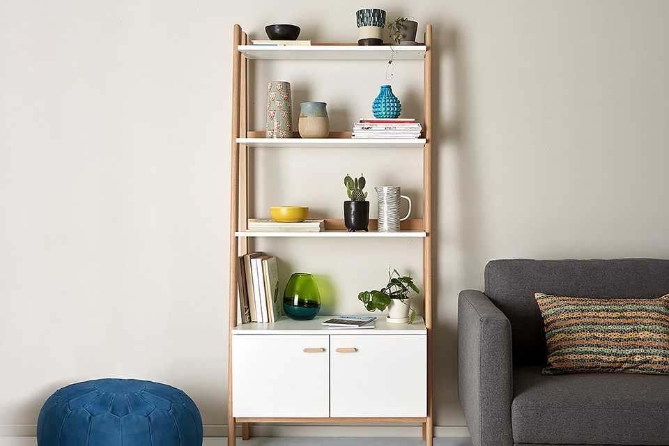 A Habitat Jerry tall white ladder shelf in a living room.
