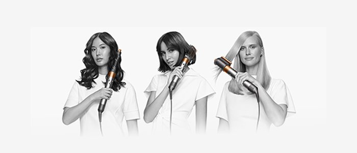 3 women using the Dyson Airwrap to style their hair.
