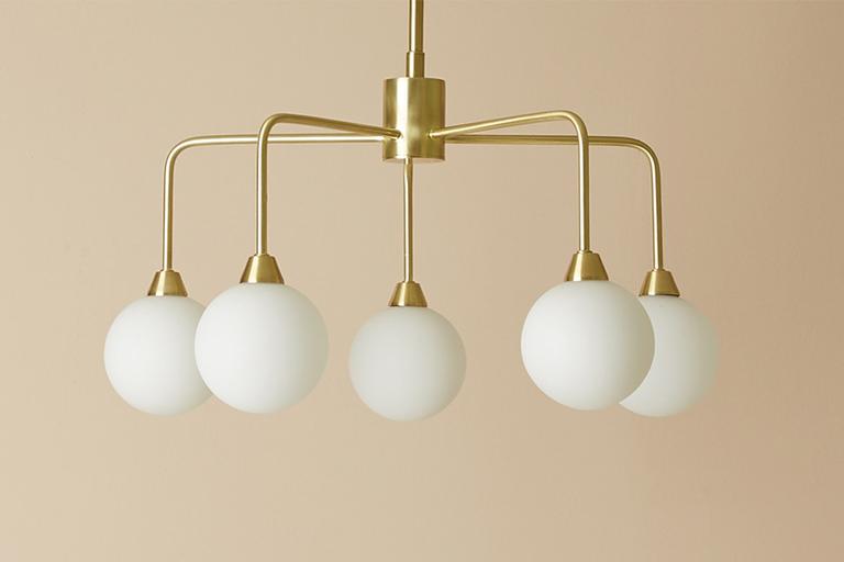 Image of claw style, gold pendant light.