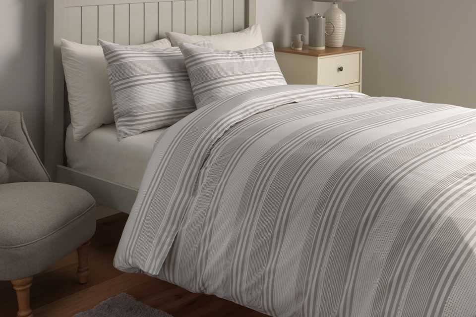 Grey and white striped bedding.