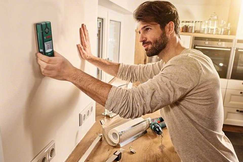 Image of a man checking the electrics.