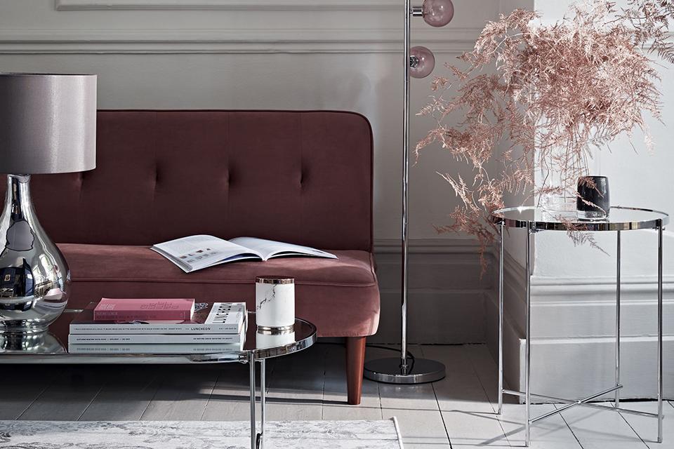 Image of a classic room with leather sofa and glass desks