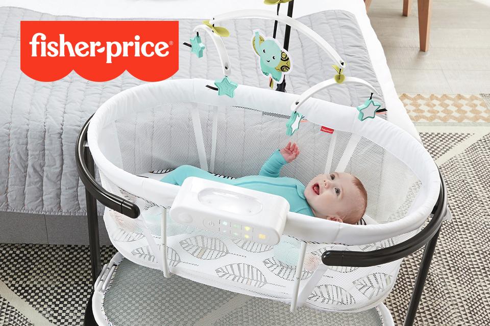 Image of a happy baby in a cotbed