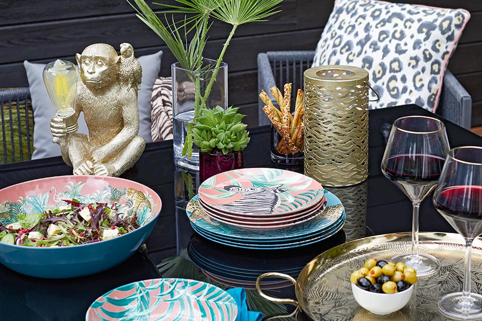 Image of colourful outdoor desk with various items on it