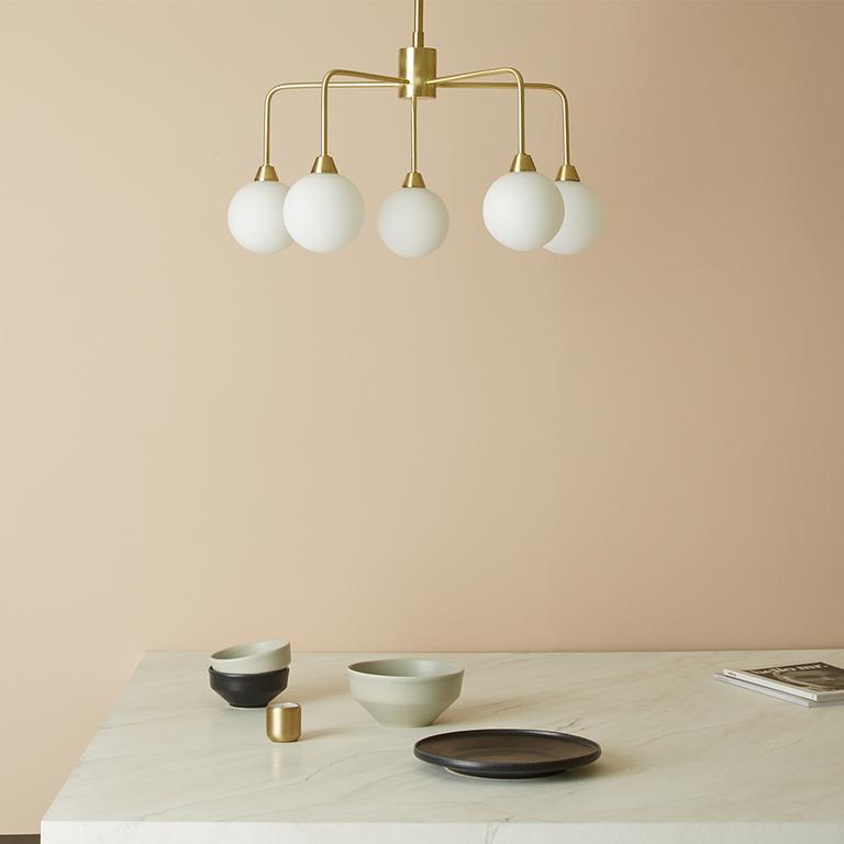 Image of a gold claw style ceiling light.