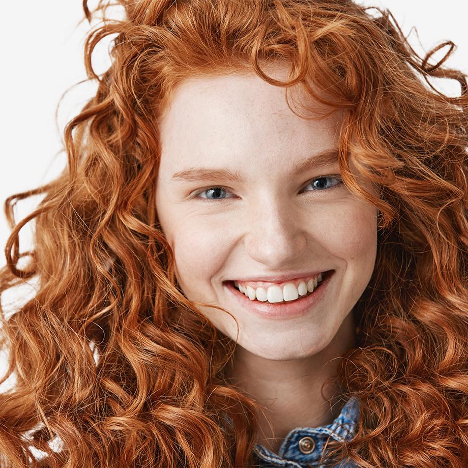 A woman with curly red hair.
