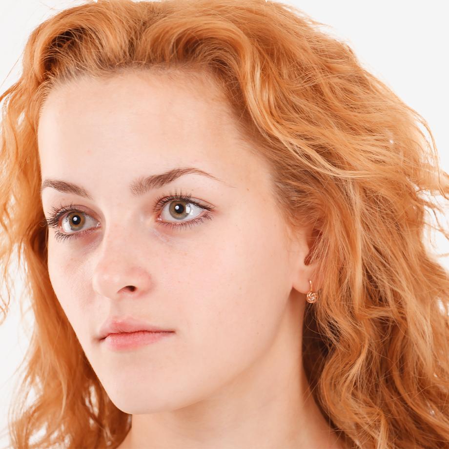 A woman with frizzy red hair.