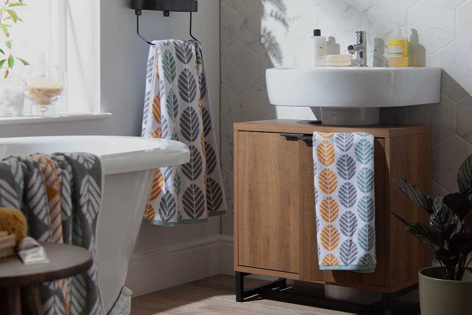 Bathroom setting with patterned towels.