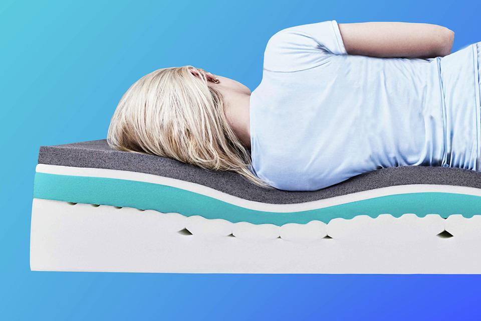 Image of a woman sleeping on her side on memory foam mattress.