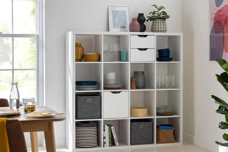 Image of a white floor-to-ceiling shelving unit.
