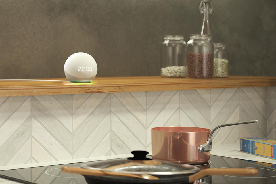 A smart speaker shown in a kitchen.