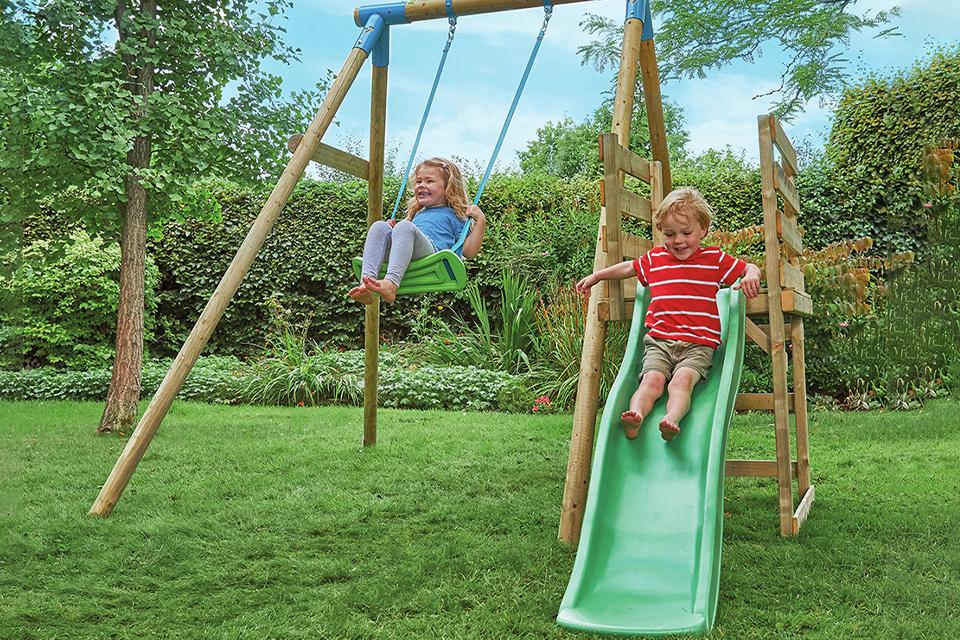 Two kids playing with TP Robin wooden kids swing and 6 foot slide multi-play.