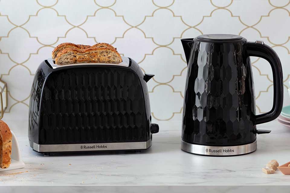 Russell Hobbs Honeycomb textured kettle and toaster on a kitchen counter.