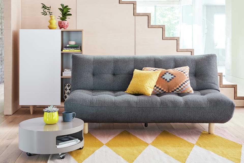 Image of a grey sofa bed.