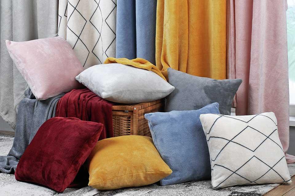 Argos Home super soft fleece cushions in various colours.