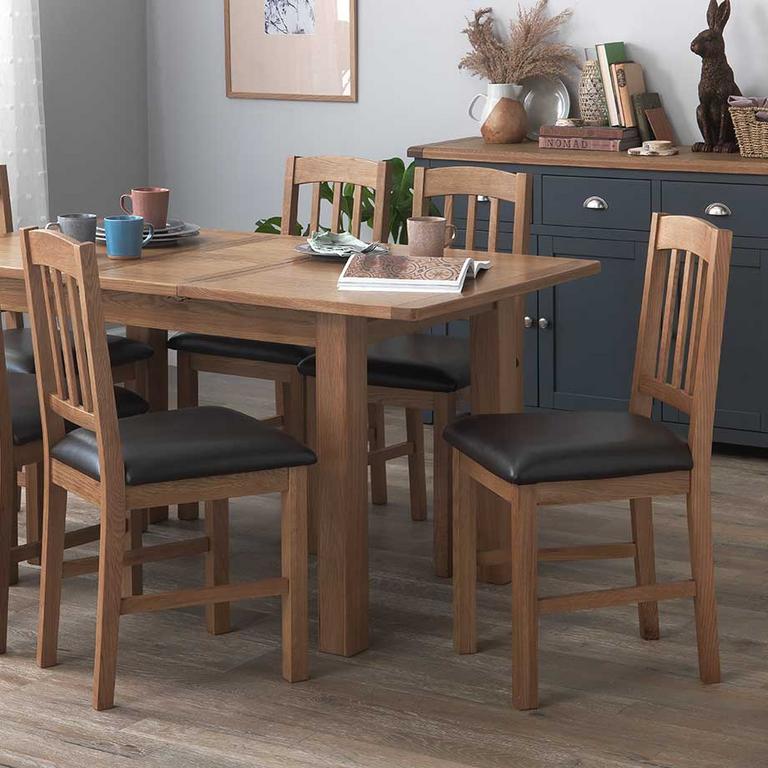 Wooden dining table, with 6 wood and grey chairs. 