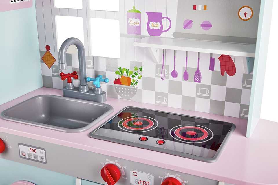 A Chad Valley Wooden Deluxe pink and blue kitchen.