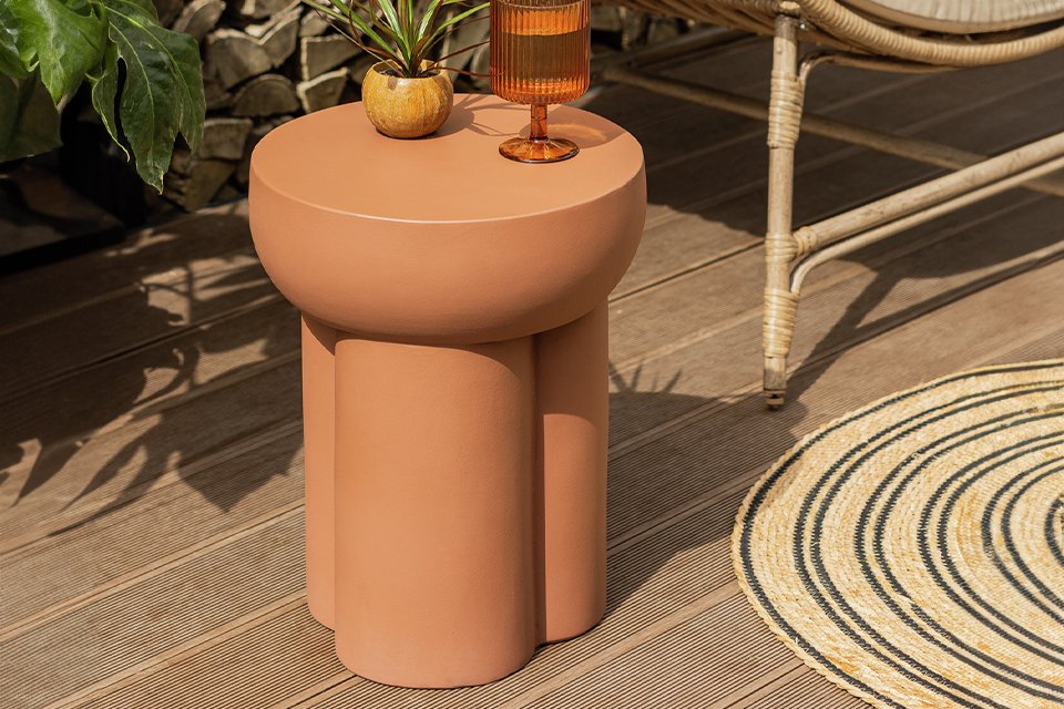 Habitat Palma round concrete effect garden side table in brown colour.