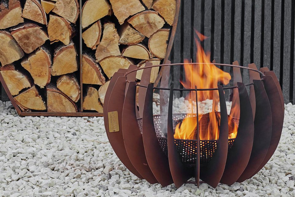 Ivyline outdoor solis fire pit in rust finish.