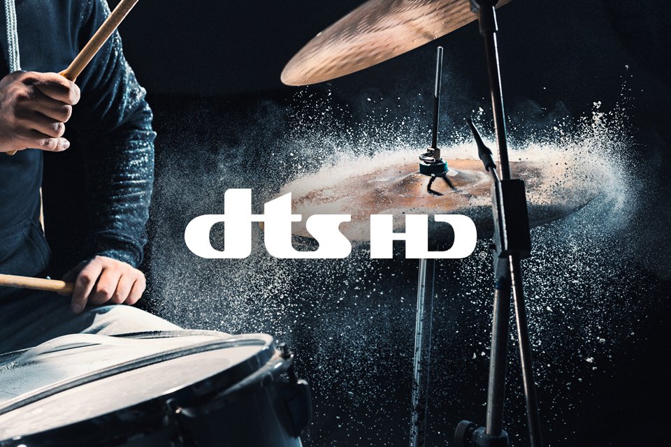 Lifestyle image depicting sound with a man playing his drum kit. 